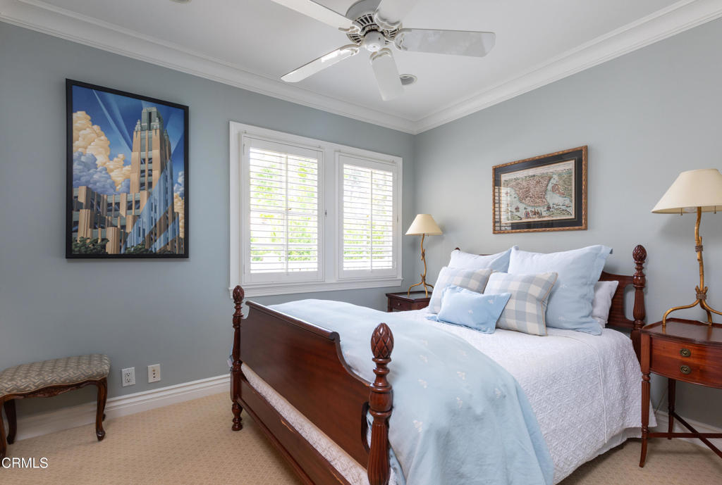 3121 Monterey Road San Marino, CA 91108 - Photo 28 of 77 a bedroom with a bed and a chandelier