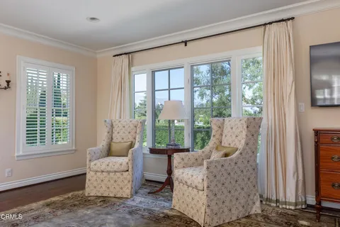 a view of a livingroom with furniture and a window