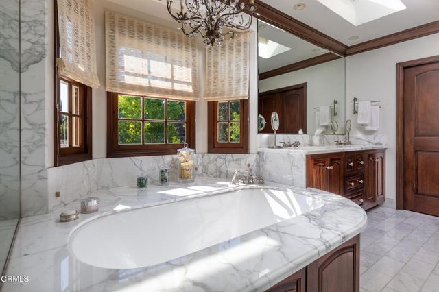 a view of a chairs and table in the patio with a yard