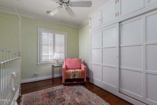 a living room with patio furniture and a large window