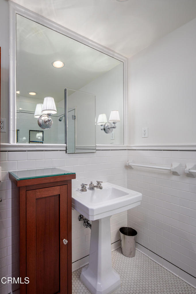 3121 Monterey Road San Marino, CA 91108 - Photo 49 of 77 a bathroom with a sink and a mirror