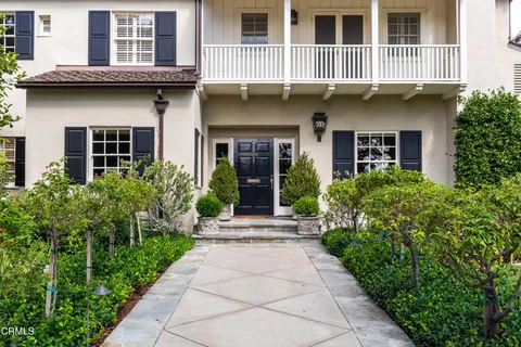 a view of a livingroom with wooden floor and furniture