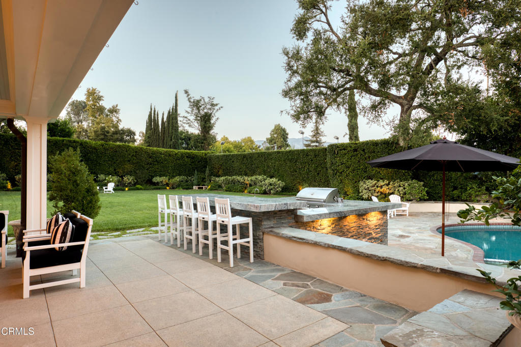 3121 Monterey Road San Marino, CA 91108 - Photo 63 of 77 a view of a chairs and table in the patio with a yard