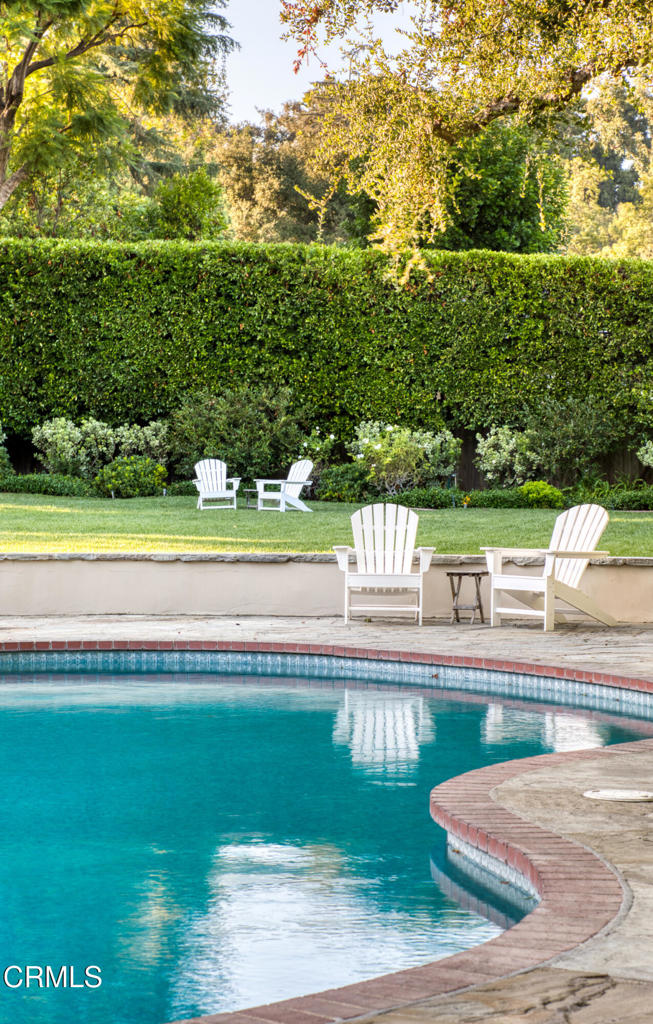 3121 Monterey Road San Marino, CA 91108 - Photo 70 of 77 a view of a swimming pool and a yard