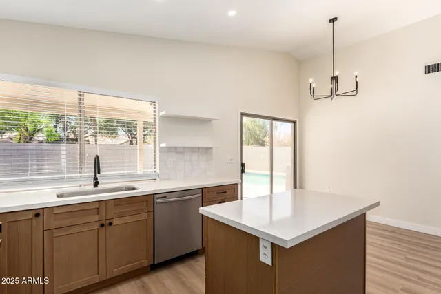 a kitchen with a sink and window