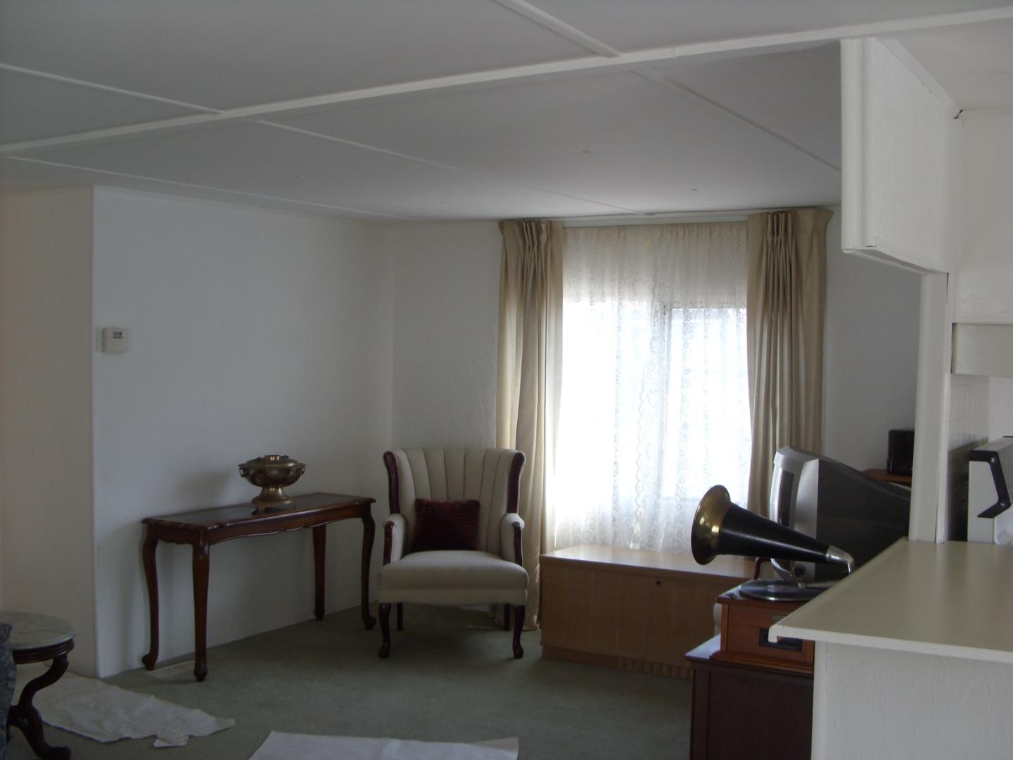 1117 Baldwin Street, Unit 74 Salinas, CA 93906 - Photo 4 of 13 a view of a livingroom with lounge chair and windows