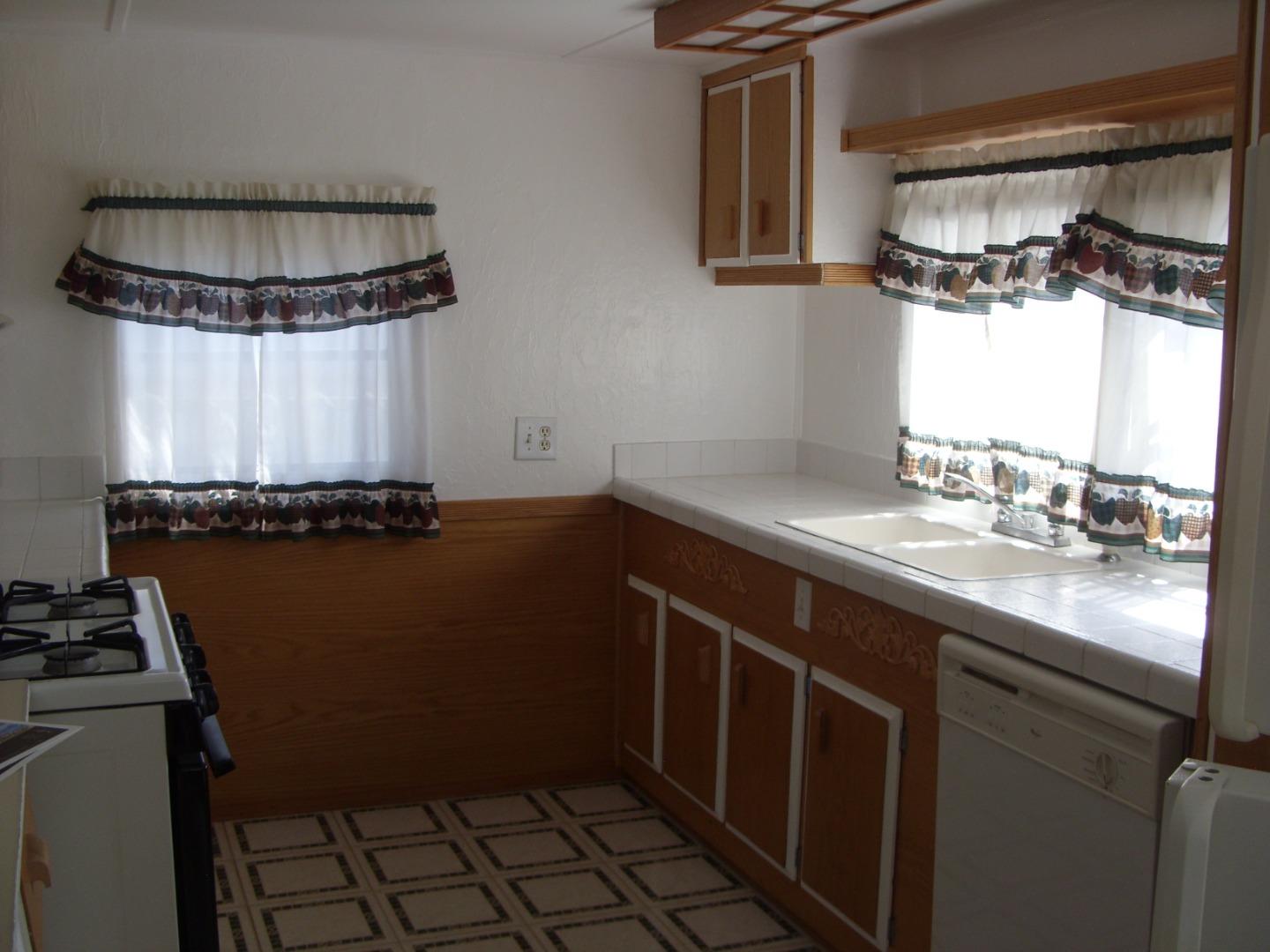 1117 Baldwin Street, Unit 74 Salinas, CA 93906 - Photo 5 of 13 a kitchen with a sink and a stove