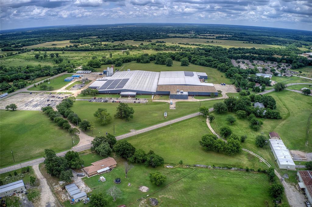 221 Maple Street Commerce, TX 75428 - Photo 4 of 19 an aerial view of a house with a yard