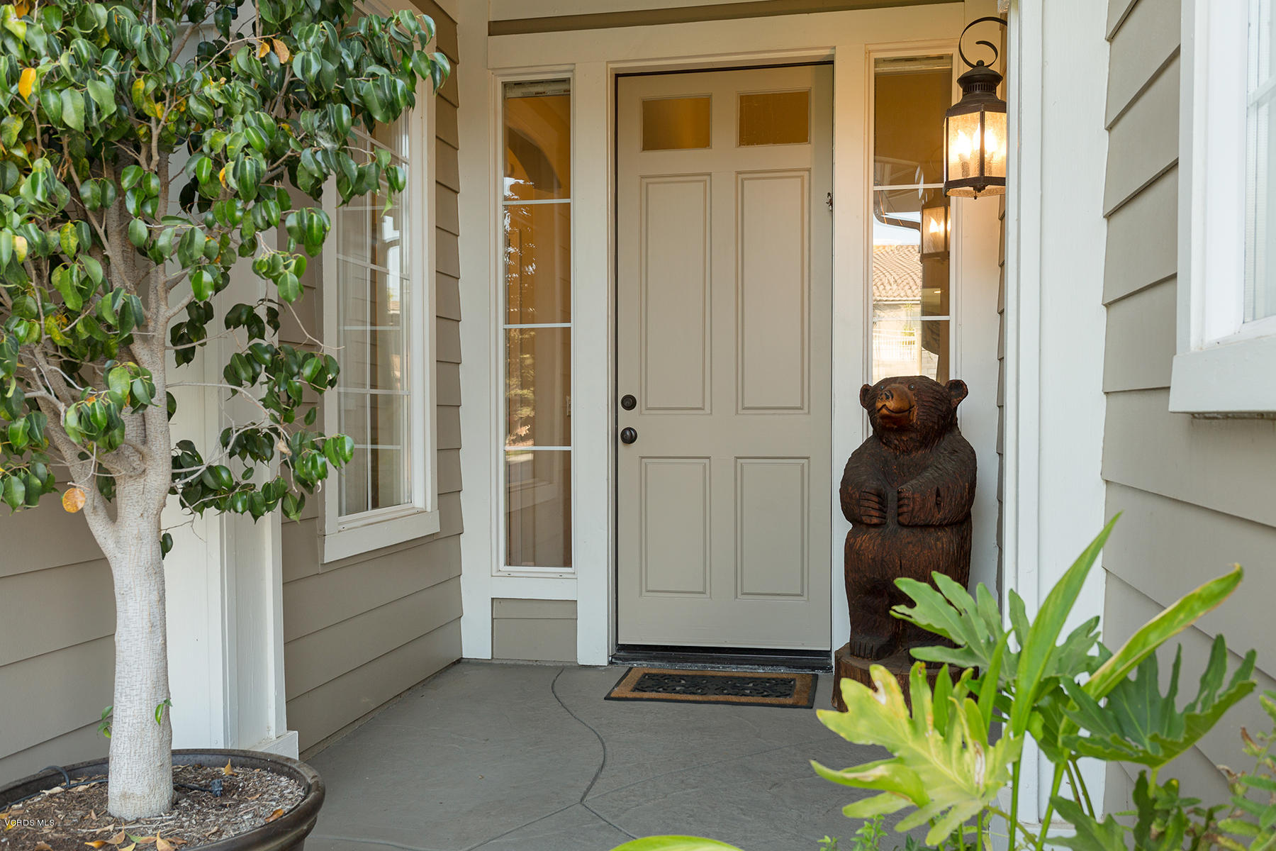 203 Knoll Ridge Road Simi Valley, CA 93065 - Photo 3 of 53 a potted plant sitting in front of a house