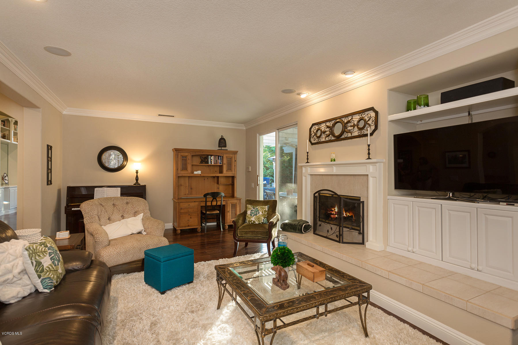 203 Knoll Ridge Road Simi Valley, CA 93065 - Photo 22 of 53 a living room with furniture a flat screen tv and a fireplace