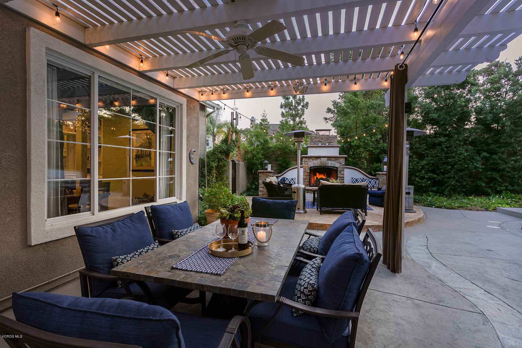203 Knoll Ridge Road Simi Valley, CA 93065 - Photo 26 of 53 a view of a patio with a table chairs and a potted plant