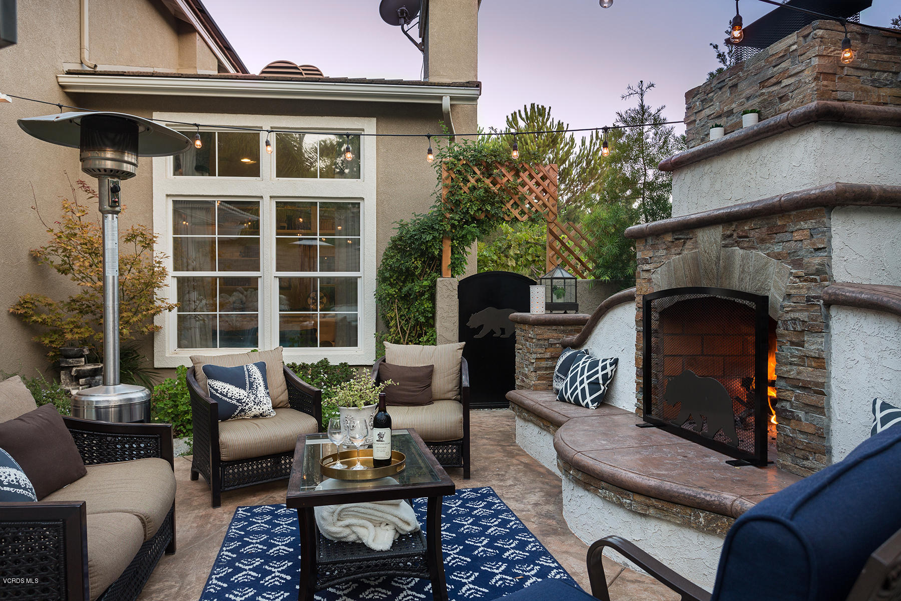 203 Knoll Ridge Road Simi Valley, CA 93065 - Photo 29 of 53 a view of a patio with couches table and chairs and potted plants
