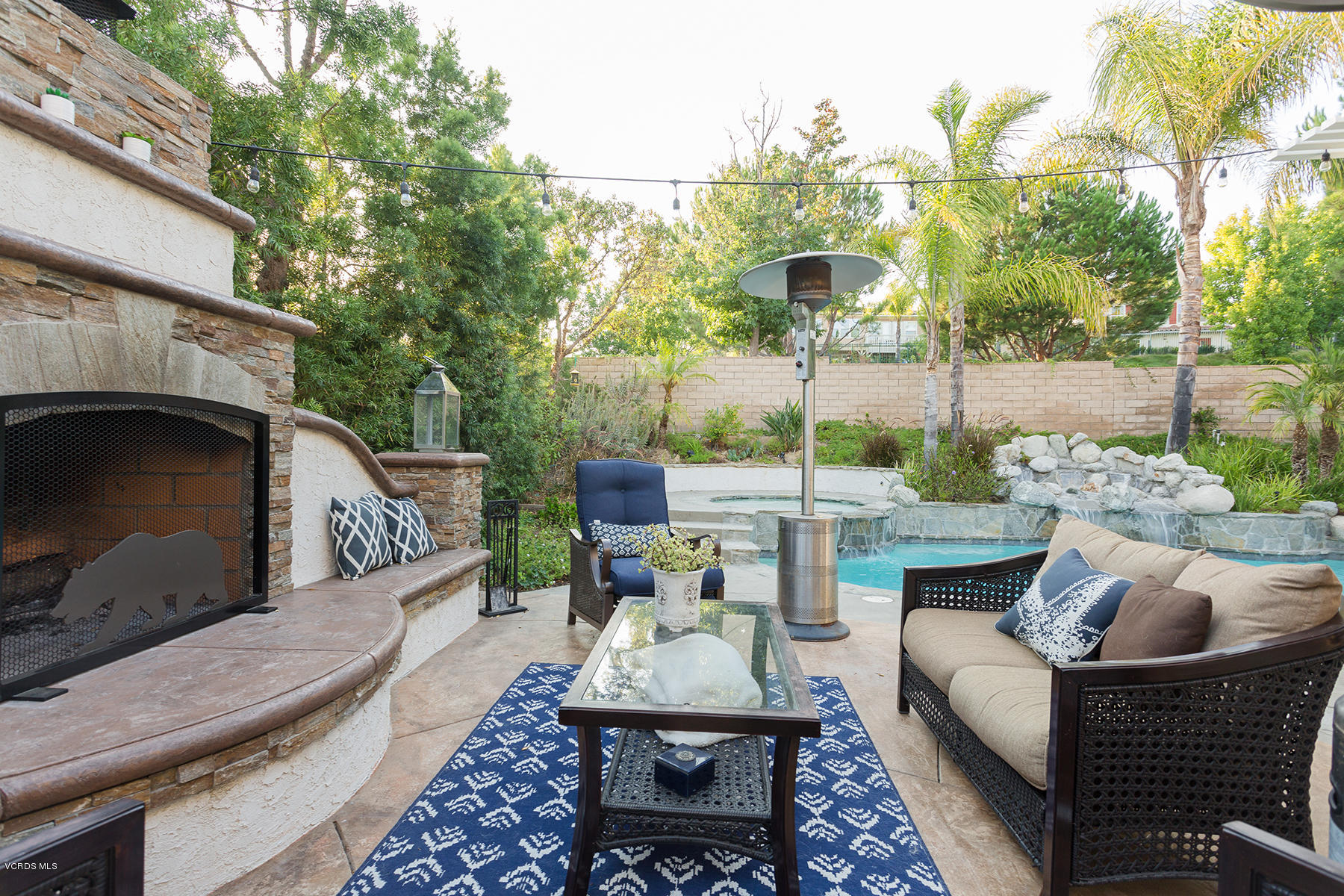 203 Knoll Ridge Road Simi Valley, CA 93065 - Photo 30 of 53 a view of a patio with couches table and chairs and potted plants