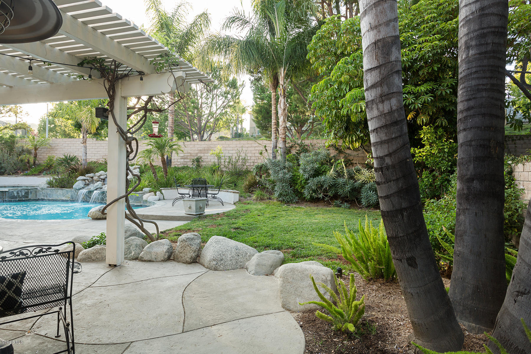 203 Knoll Ridge Road Simi Valley, CA 93065 - Photo 34 of 53 a view of backyard with outdoor seating and green space