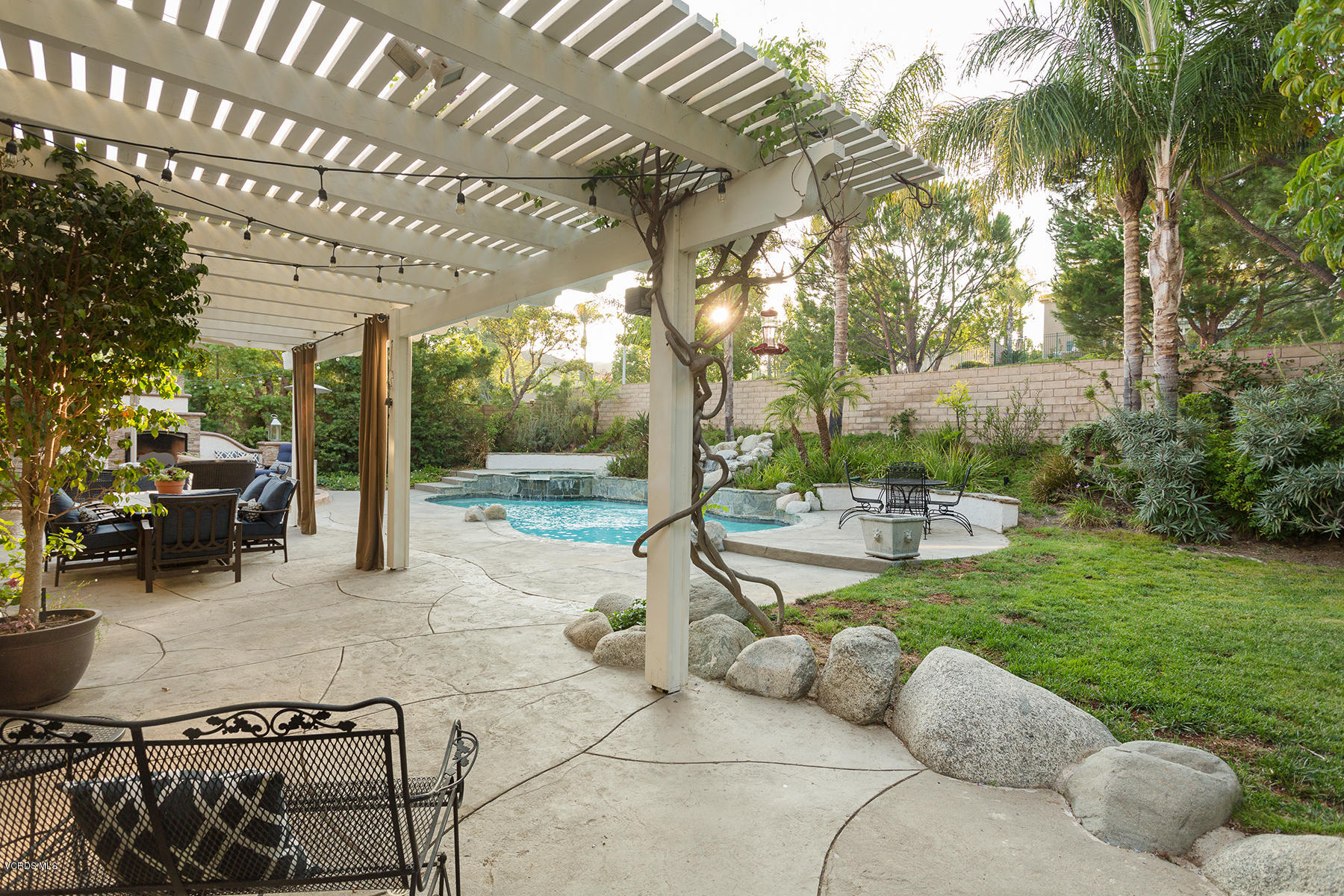 203 Knoll Ridge Road Simi Valley, CA 93065 - Photo 35 of 53 a view of a patio with table and chairs and potted plants