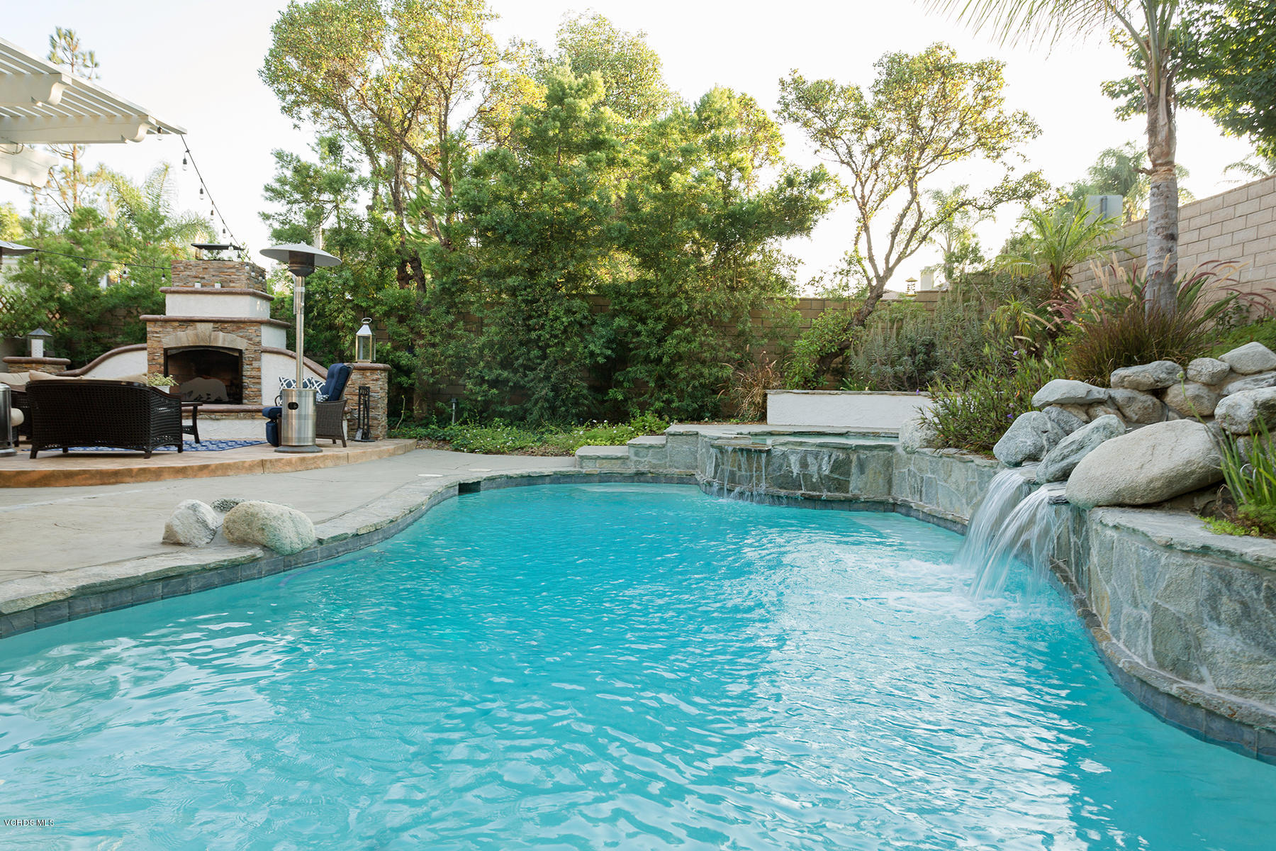 203 Knoll Ridge Road Simi Valley, CA 93065 - Photo 36 of 53 a view of backyard with swimming pool and seating space
