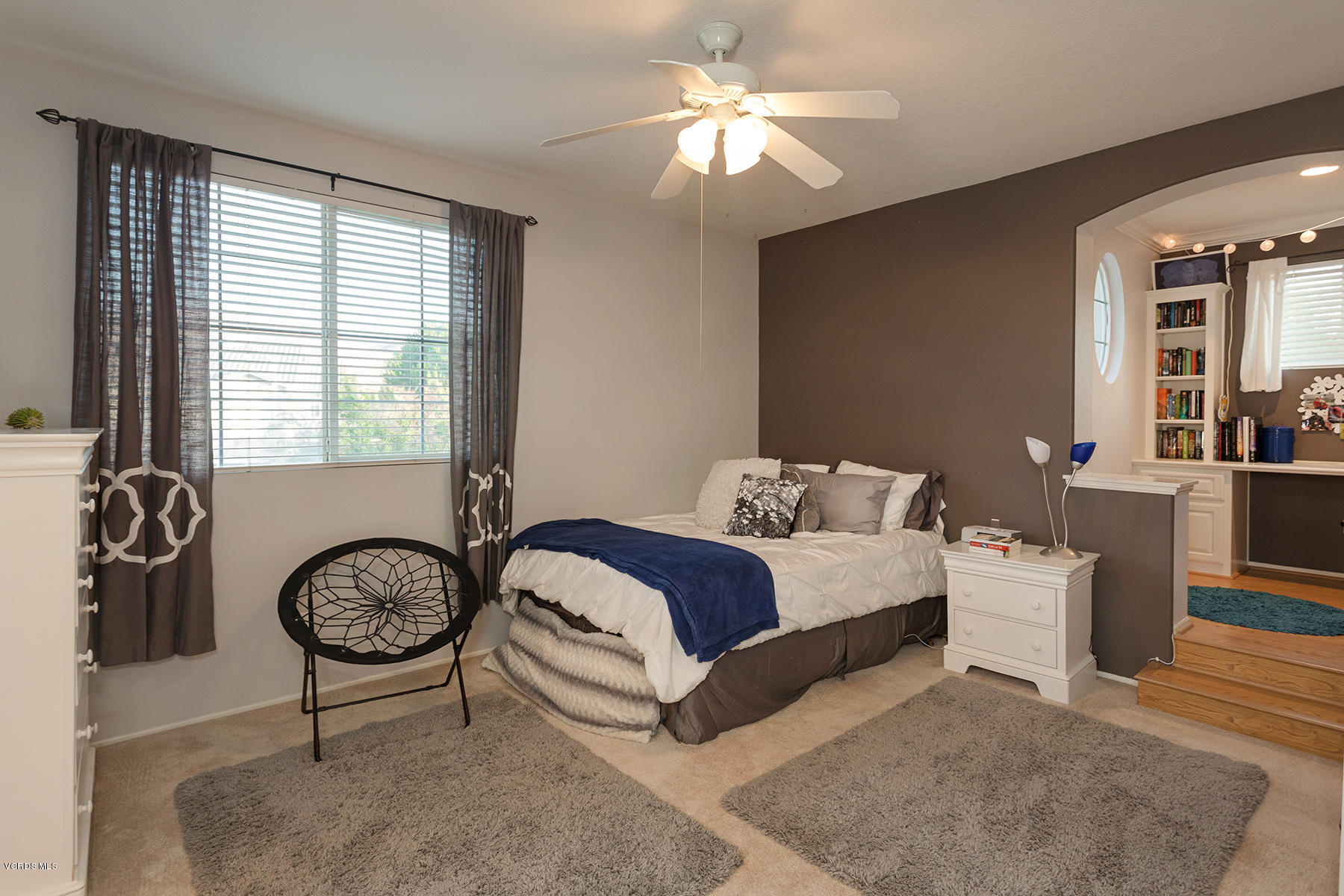 203 Knoll Ridge Road Simi Valley, CA 93065 - Photo 45 of 53 a bedroom with a bed and a chandelier