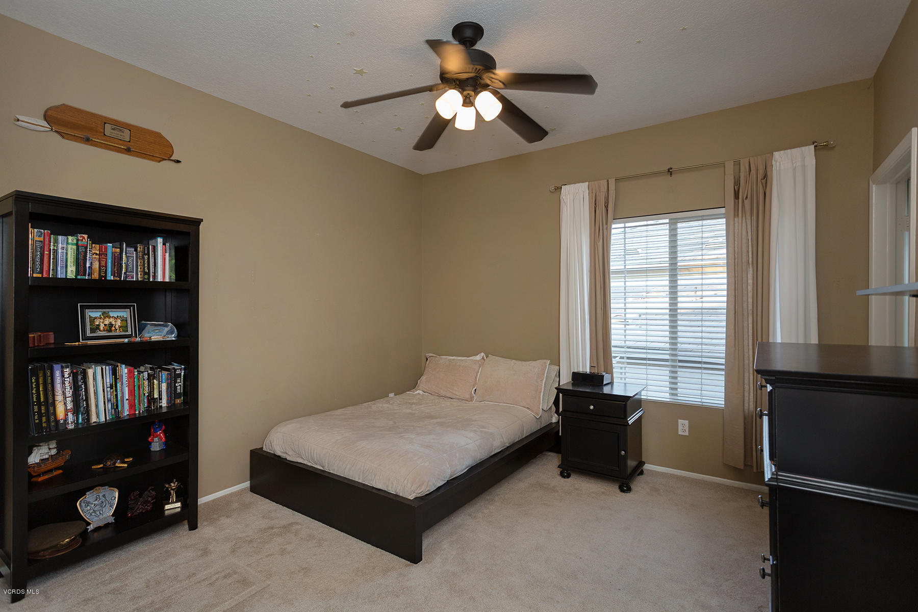 203 Knoll Ridge Road Simi Valley, CA 93065 - Photo 48 of 53 a bedroom with a bed and a book shelf