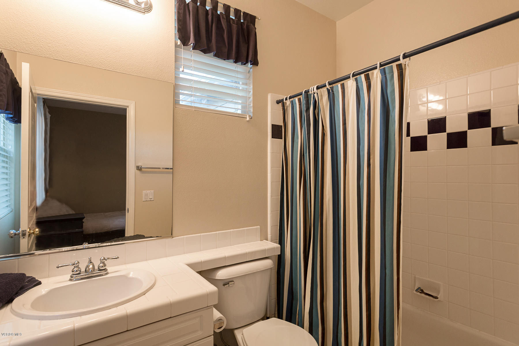 203 Knoll Ridge Road Simi Valley, CA 93065 - Photo 49 of 53 a bathroom with a sink and a mirror