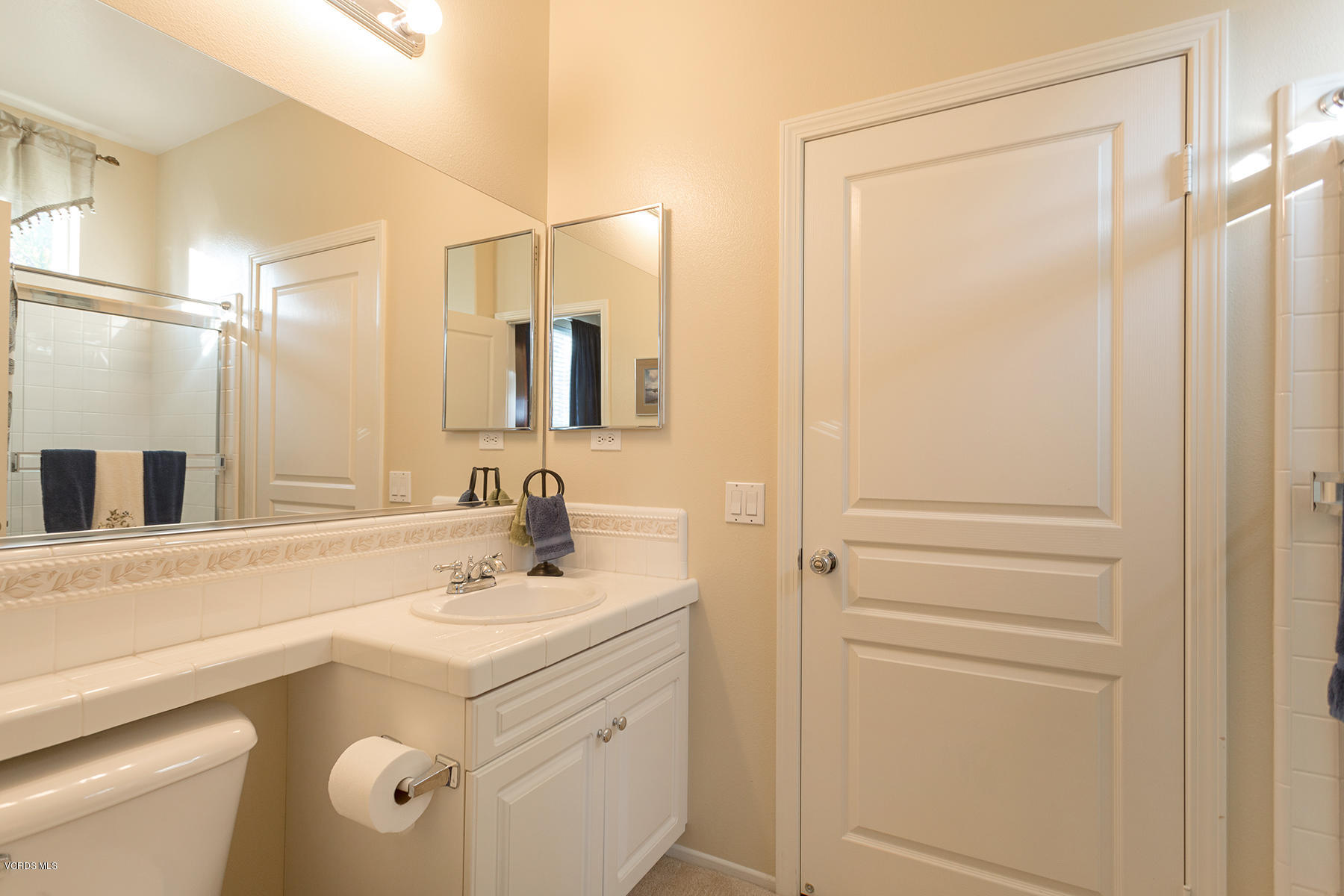 203 Knoll Ridge Road Simi Valley, CA 93065 - Photo 6 of 53 a bathroom with a sink and a mirror
