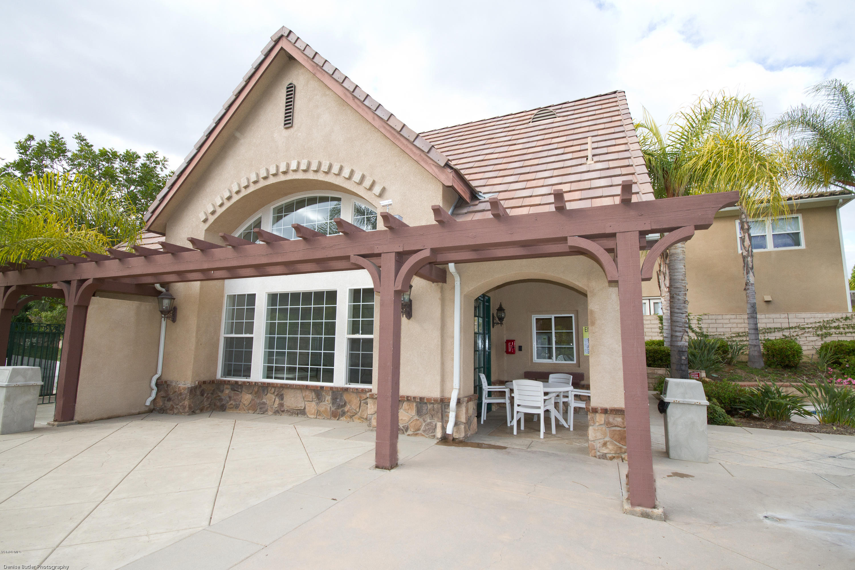 203 Knoll Ridge Road Simi Valley, CA 93065 - Photo 53 of 53 a view of a house with large windows and a table and chairs