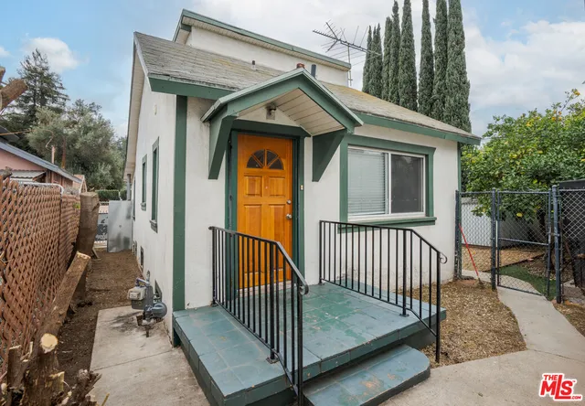 a view of a house with wooden floor roof and balcony