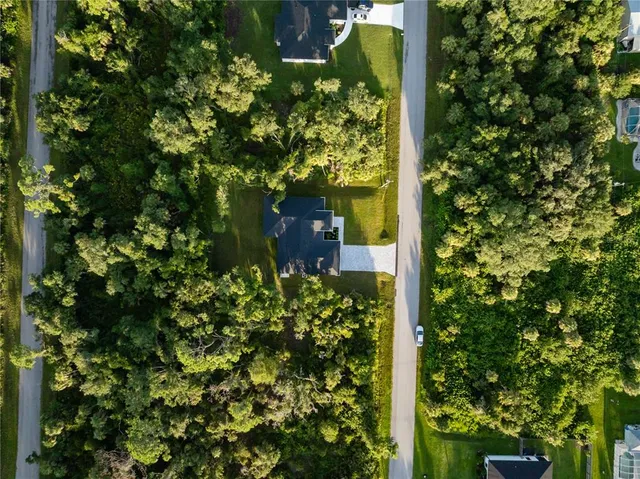 a kitchen with kitchen island stainless steel appliances a stove refrigerator sink and microwave