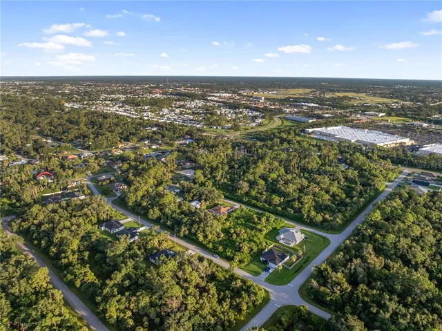 a kitchen with a sink a stove and a refrigerator