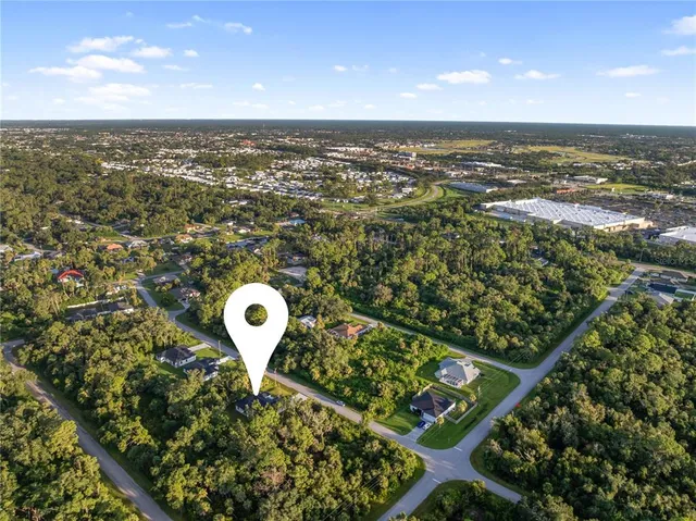 a living room with a couch and a floor to ceiling window