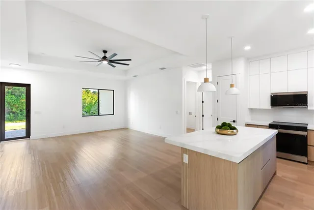 a view of a kitchen with a sink and a window