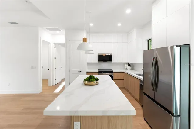 a view of a park with a tree in the background