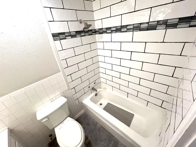 a bathroom with a bathtub and sink