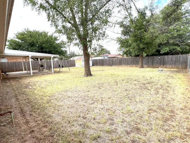 a bathroom with a sink and a yard