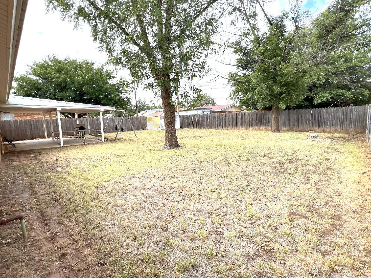 5540 18th Street Lubbock, TX 79416 - Photo 6 of 18 a bathroom with a sink and a yard