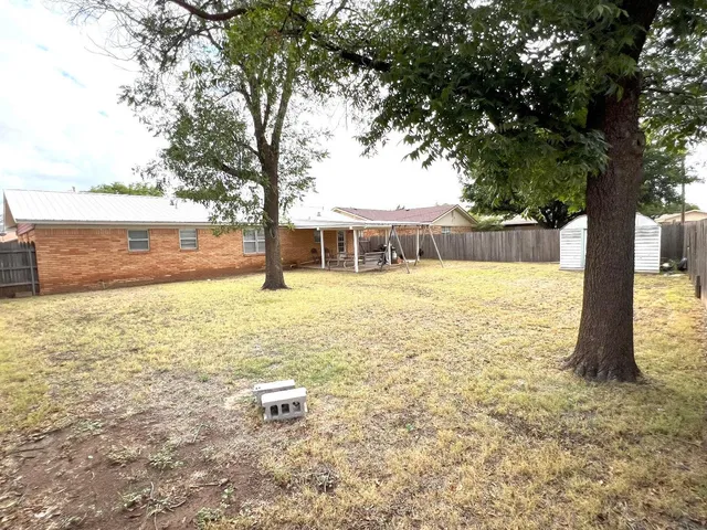 a view of a swimming pool with an ocean view