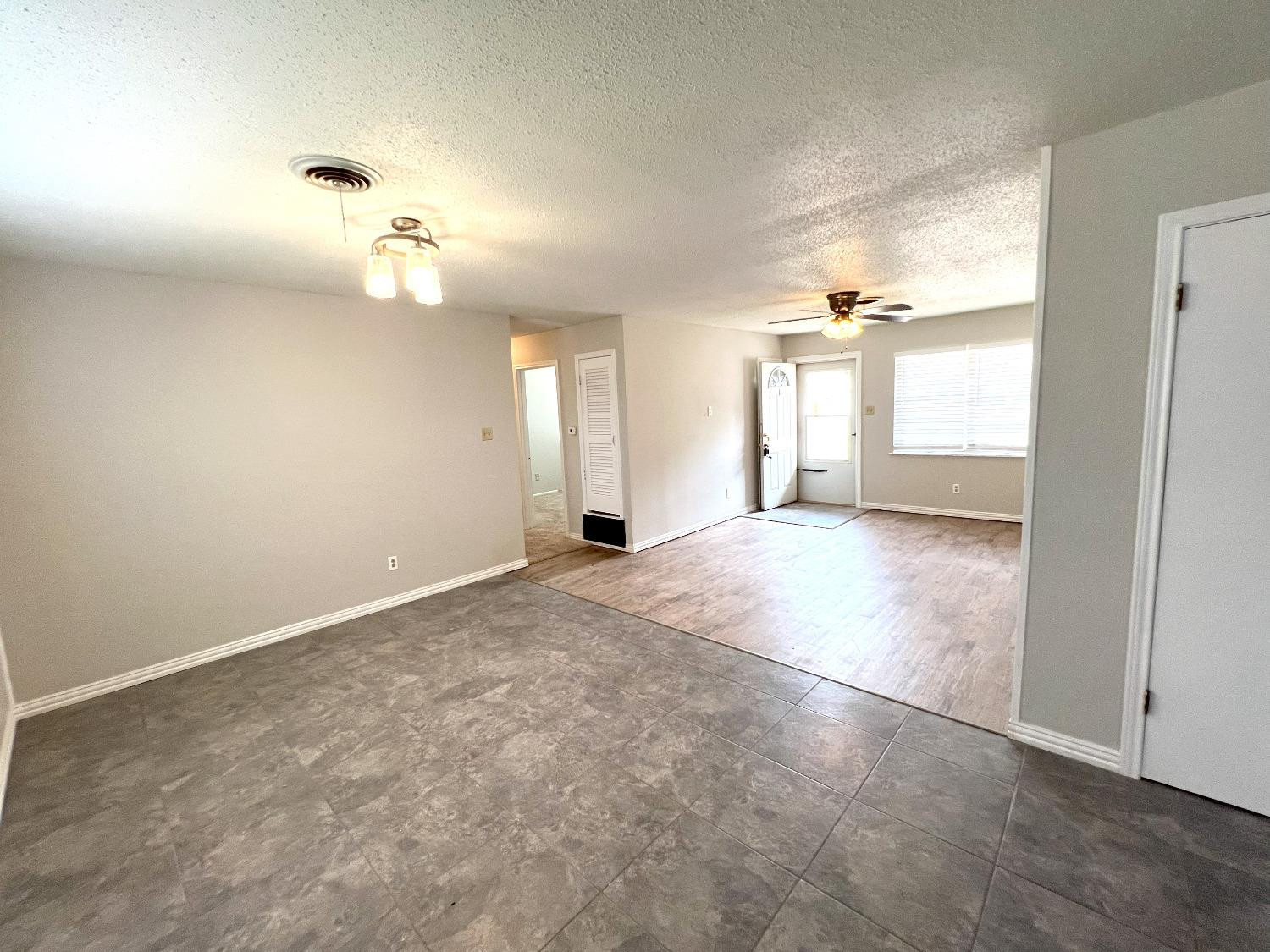 5540 18th Street Lubbock, TX 79416 - Photo 9 of 18 an empty room with a empty space and windows