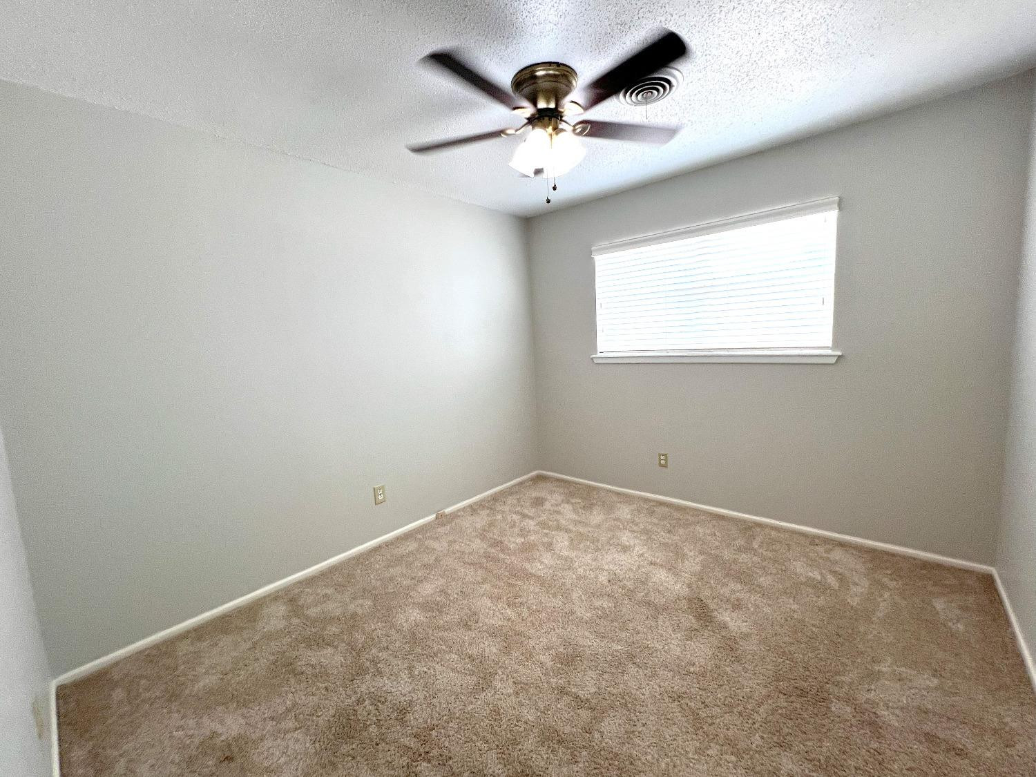 5540 18th Street Lubbock, TX 79416 - Photo 10 of 18 an empty room with a window