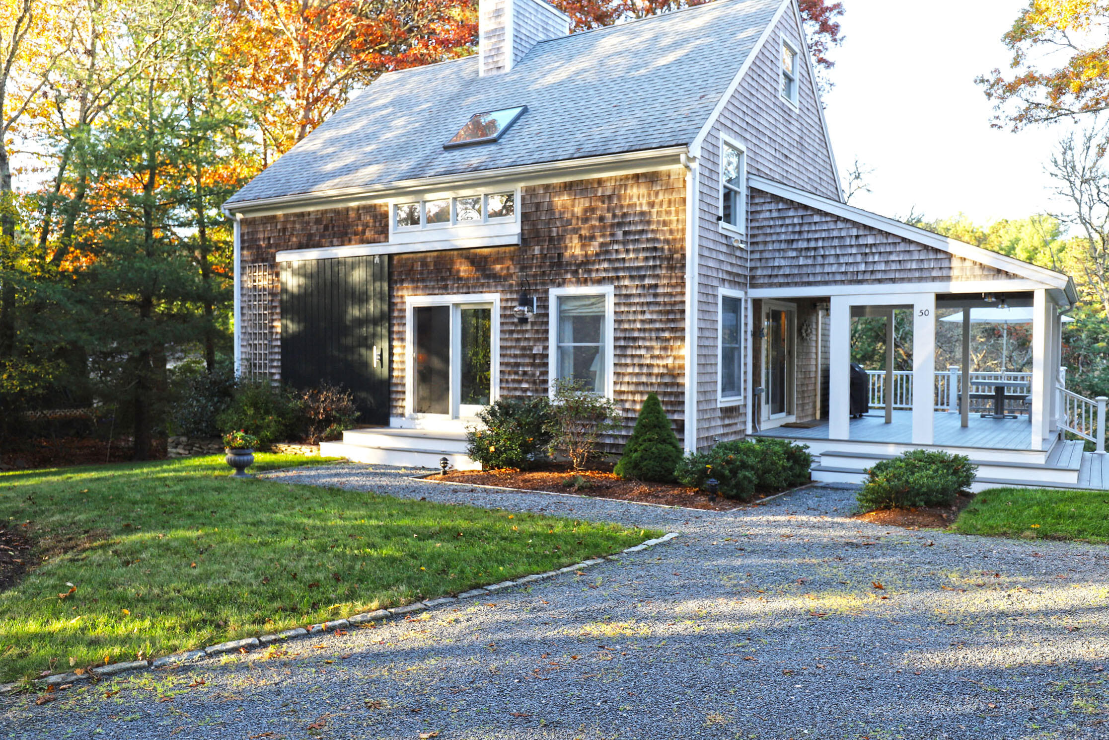 50 Jackson Drive Cotuit, MA 02635 - Photo 1 of 30 a front view of a house with a yard