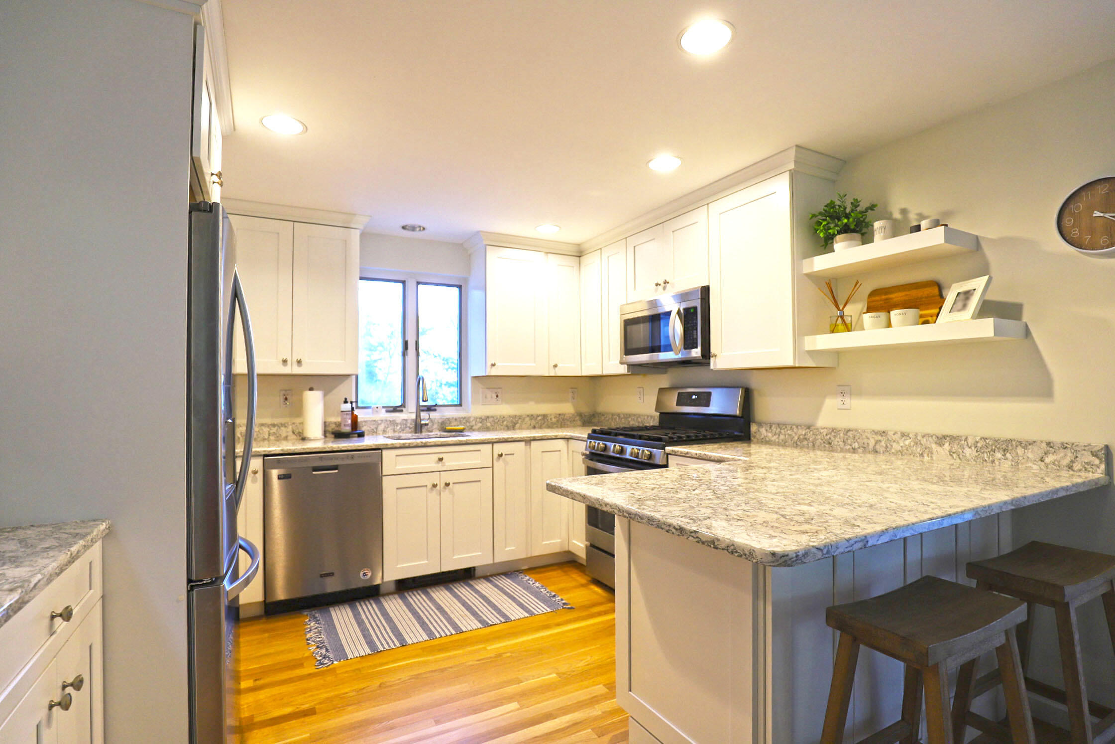 50 Jackson Drive Cotuit, MA 02635 - Photo 11 of 30 a kitchen with a sink stove and refrigerator