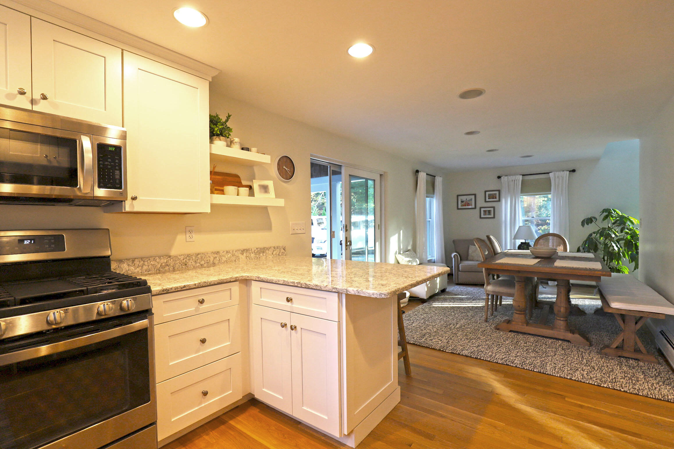 50 Jackson Drive Cotuit, MA 02635 - Photo 12 of 30 a kitchen with stainless steel appliances granite countertop a stove and a sink