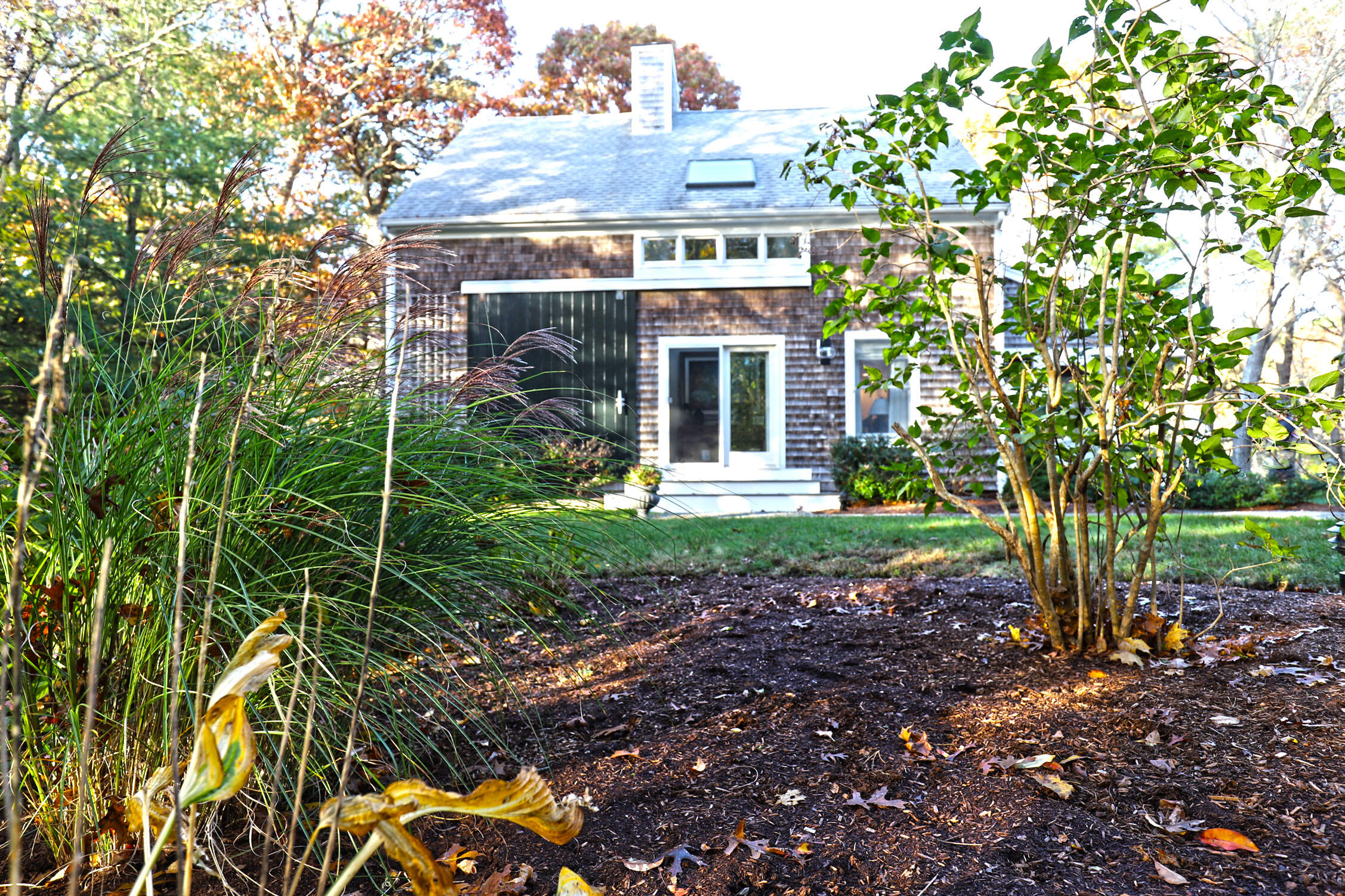 50 Jackson Drive Cotuit, MA 02635 - Photo 2 of 30 a front view of a house with plants