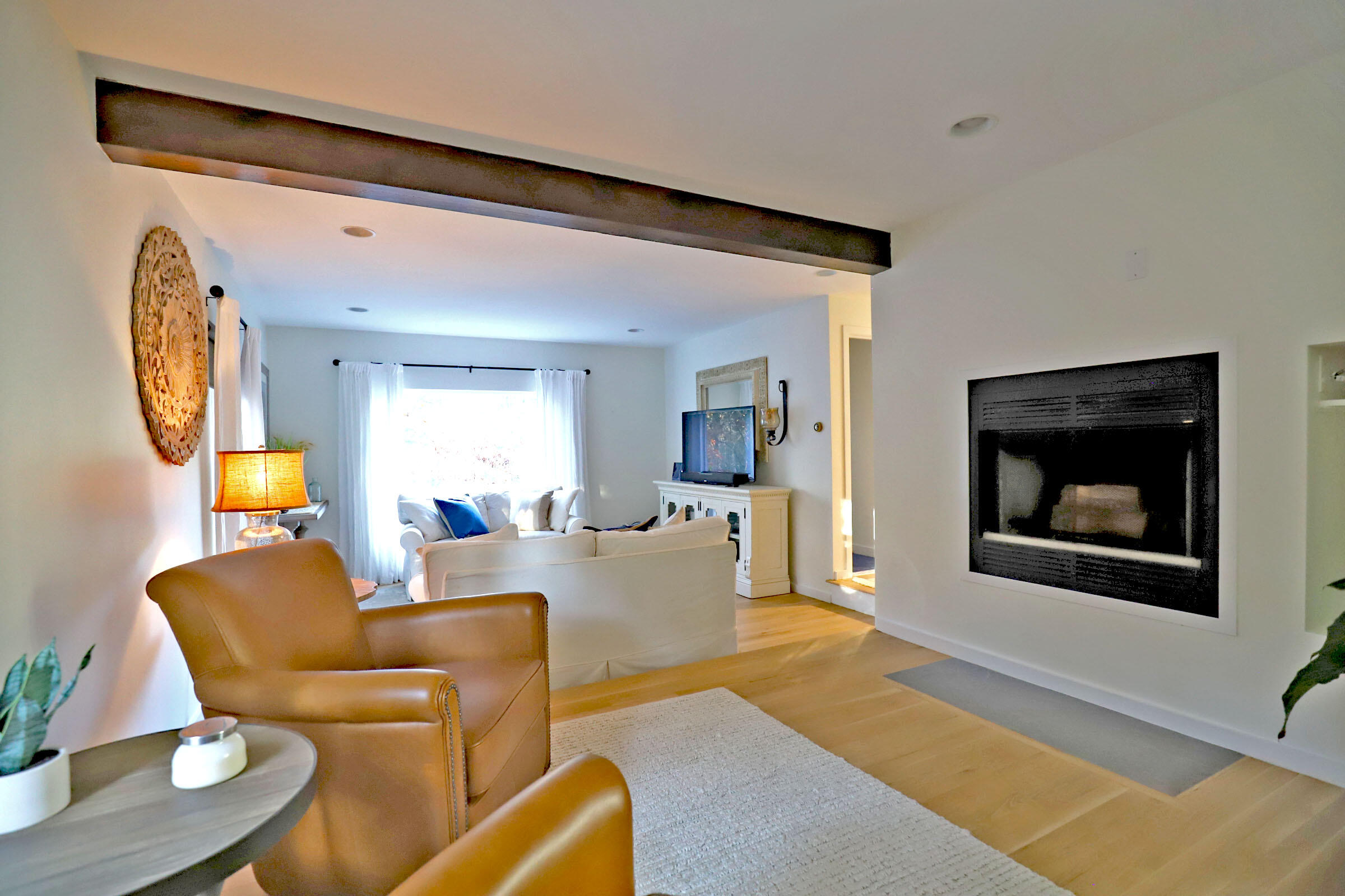 50 Jackson Drive Cotuit, MA 02635 - Photo 22 of 30 a living room with furniture and a large window