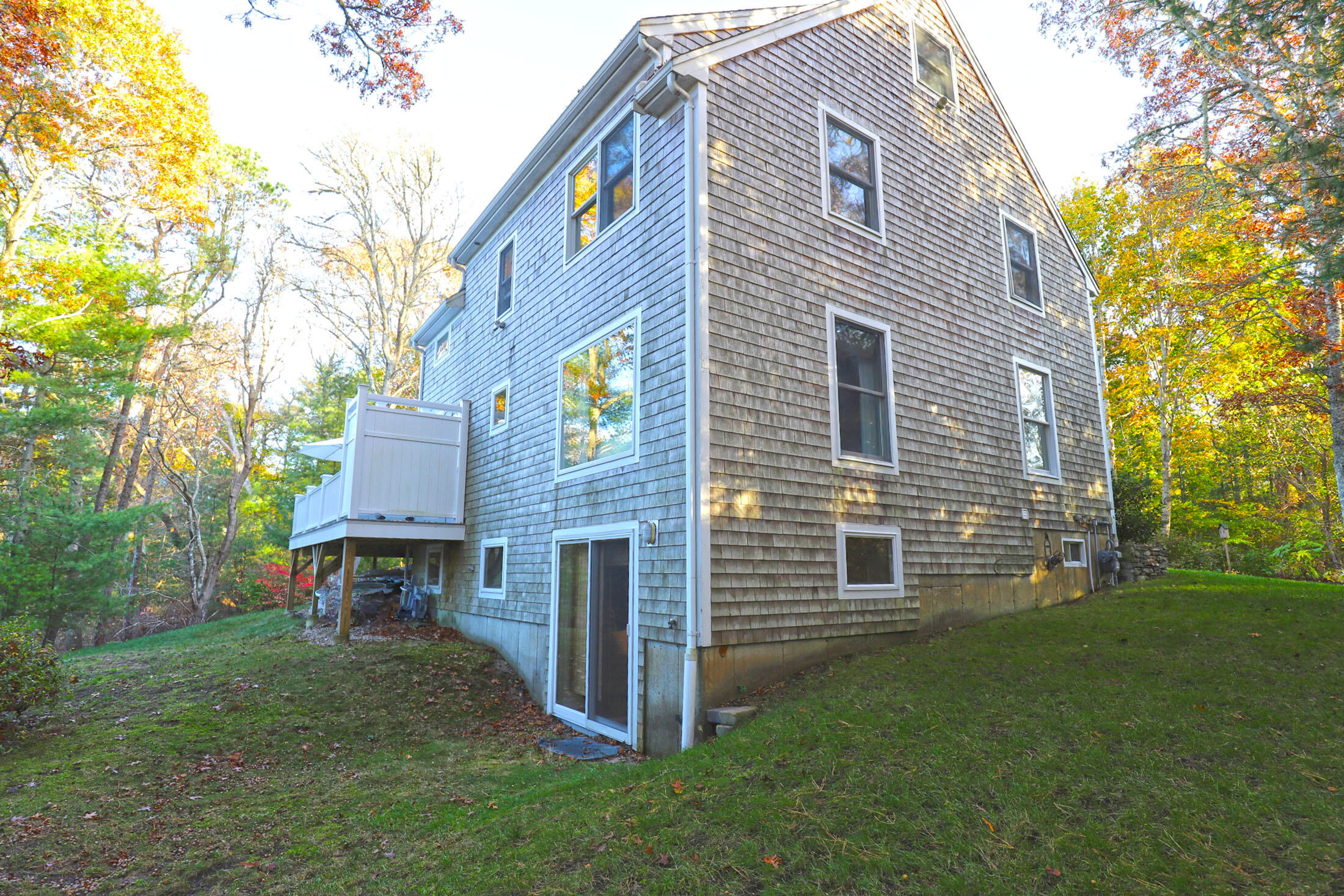 50 Jackson Drive Cotuit, MA 02635 - Photo 4 of 30 a front view of a house with a yard and garage