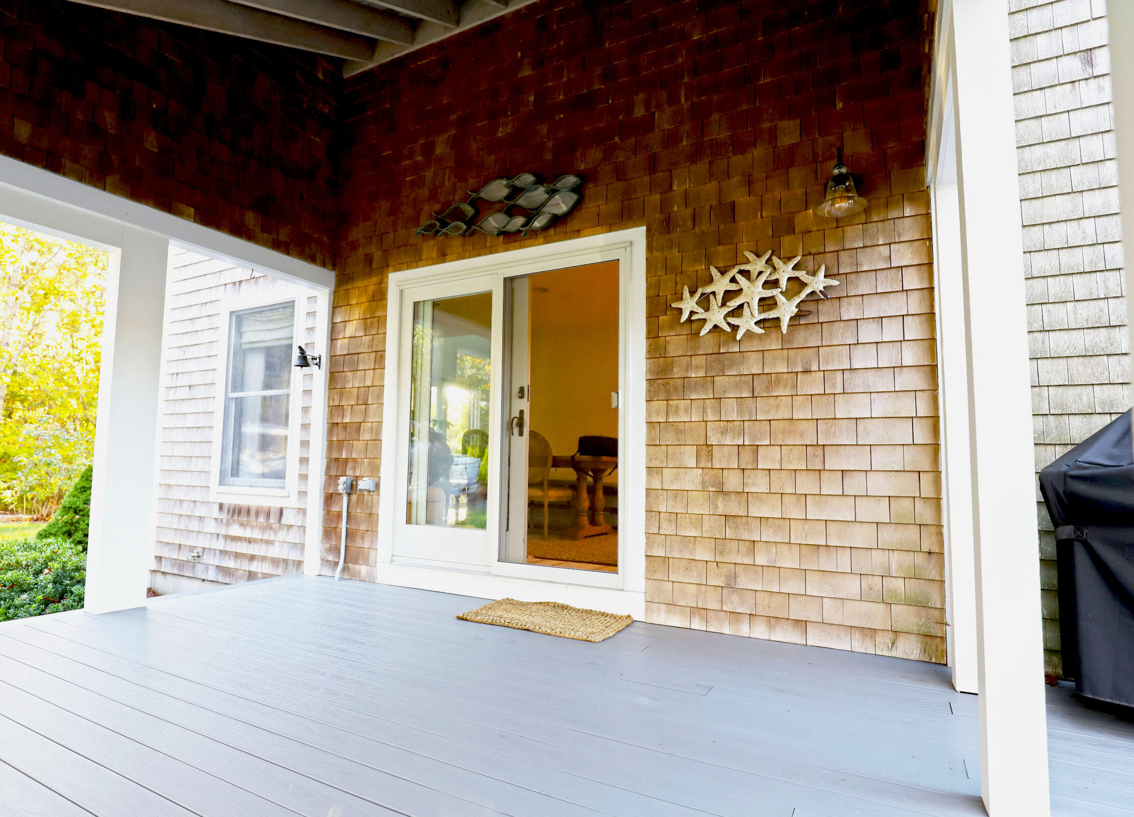 50 Jackson Drive Cotuit, MA 02635 - Photo 6 of 30 a view of an empty room with a fireplace and a window