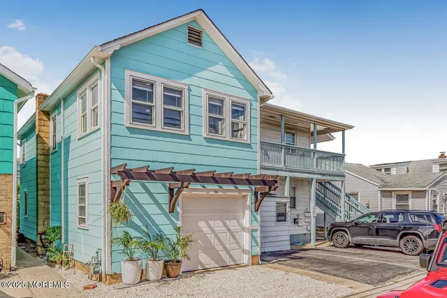 a front view of a house with parking