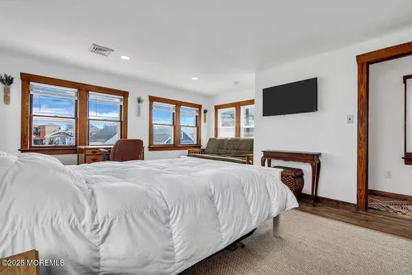 a bed room with a bed and a chair