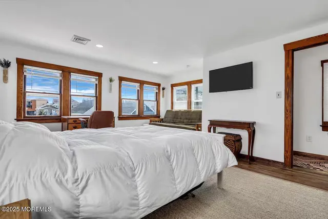 a bed room with a bed and a chair