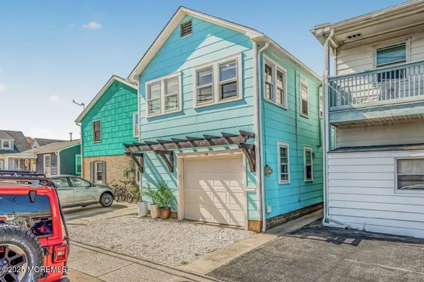 a front view of a house with parking