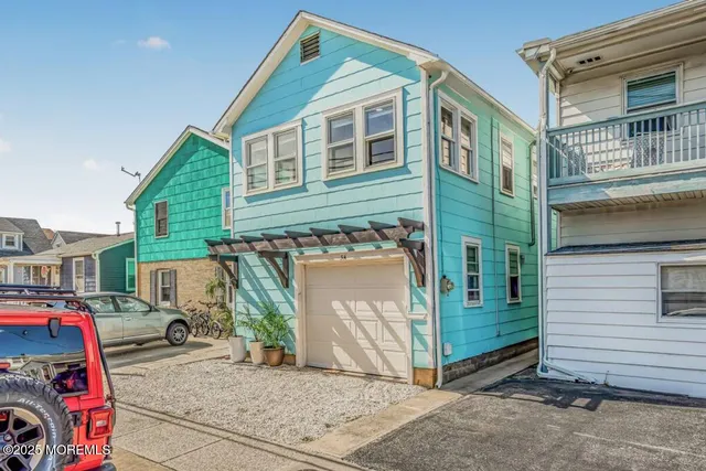 a front view of a house with parking