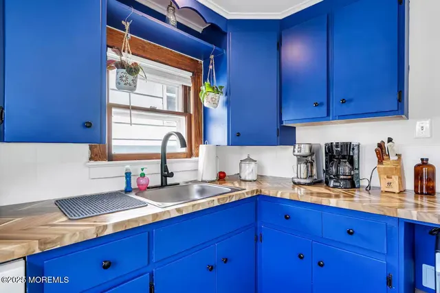 a work place with furniture and wooden floor